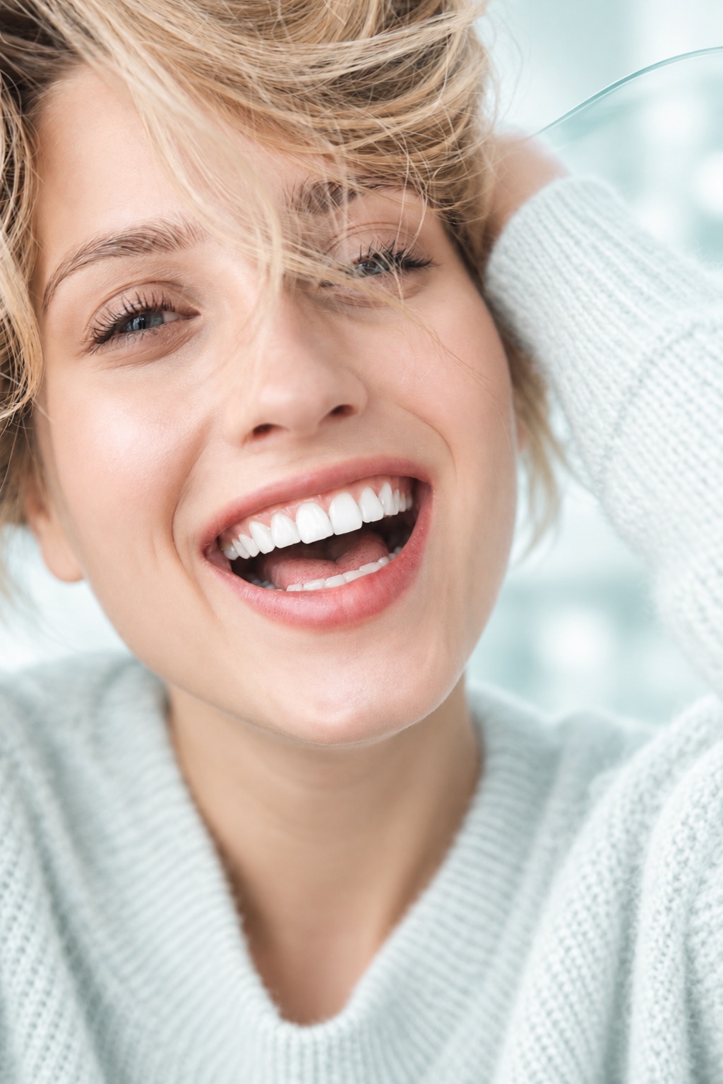 Smiling woman, illustrating one patient's journey to dental implants in Turkey